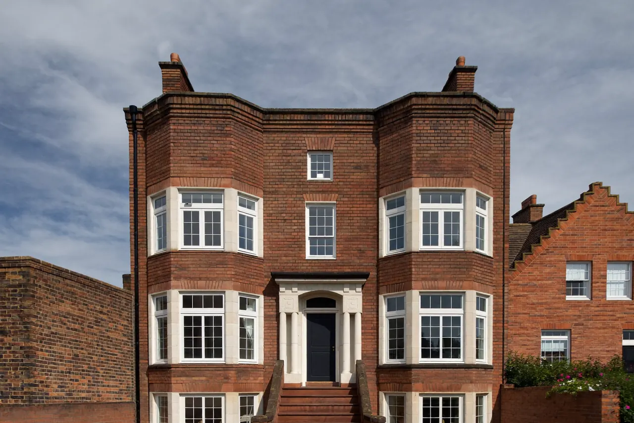 New white uPVC windows fitted to a brick terraced house